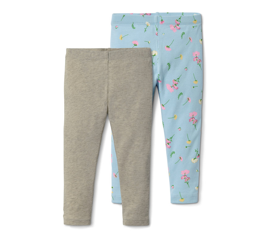 Zwei Leggings aus Bio-Baumwolle: eine grau, die andere hellblau mit Blumenmuster.