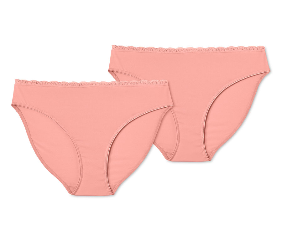 Zwei aprikosenfarbene Jazzpants mit Spitze liegen übereinander.