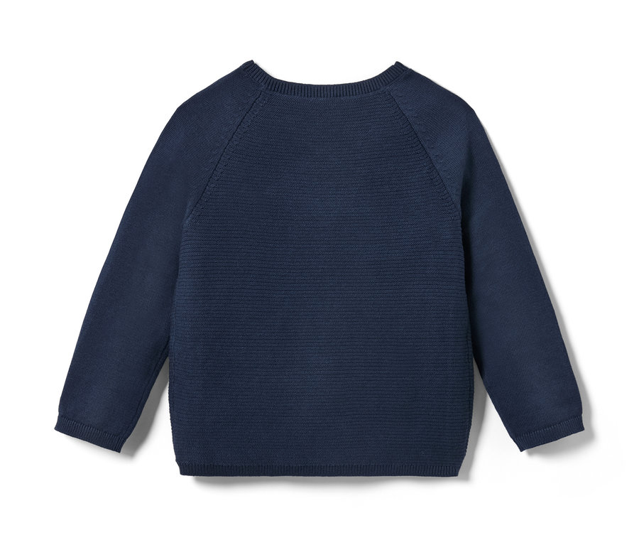 Detailaufnahme einer Baby-Strickjacke.