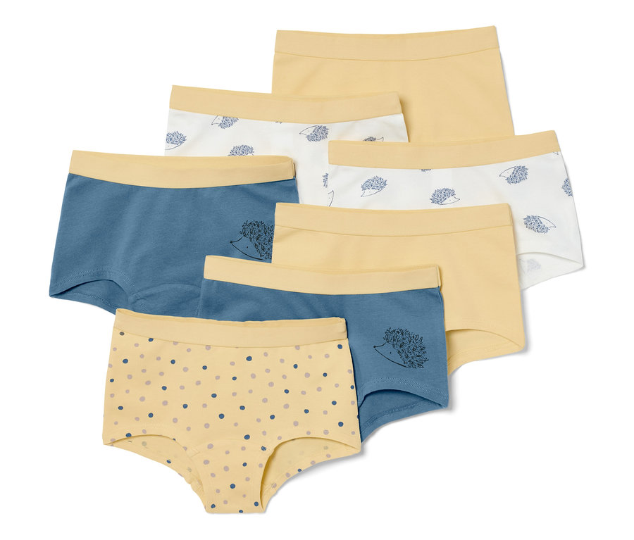 Ein Set aus 7 Kinder-Pantys in verschiedenen Farben und Mustern.