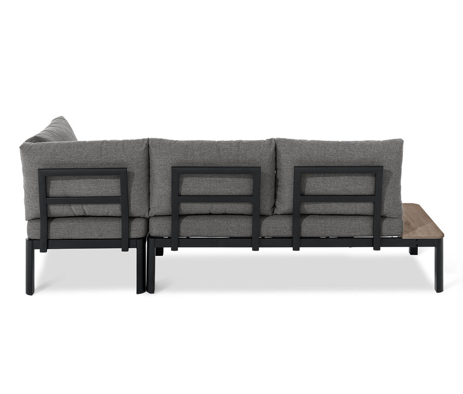 Rückansicht einer flexiblen Lounge-Ecke mit Duraboard®-Tischplatten, grauen Kissen und schwarzem Rahmen.