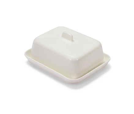Eine weiße Butterdose.