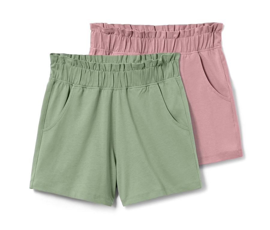 Zwei Kinder-Jersey-Shorts, eine hellgrüne und eine rosa.