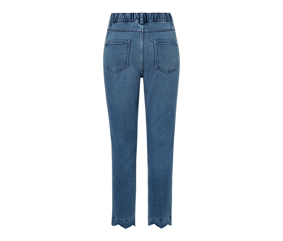 Blaue 7/8-Treggings mit Gummibund und dekorativer Lochstickerei am Saum.