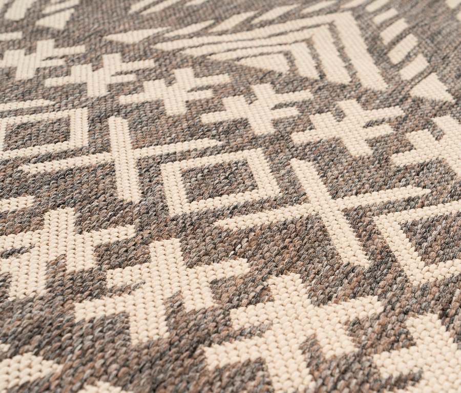 Nahaufnahme eines cremefarbenen Kayoom Outdoorteppichs »Splash 500« mit geometrischem Muster.