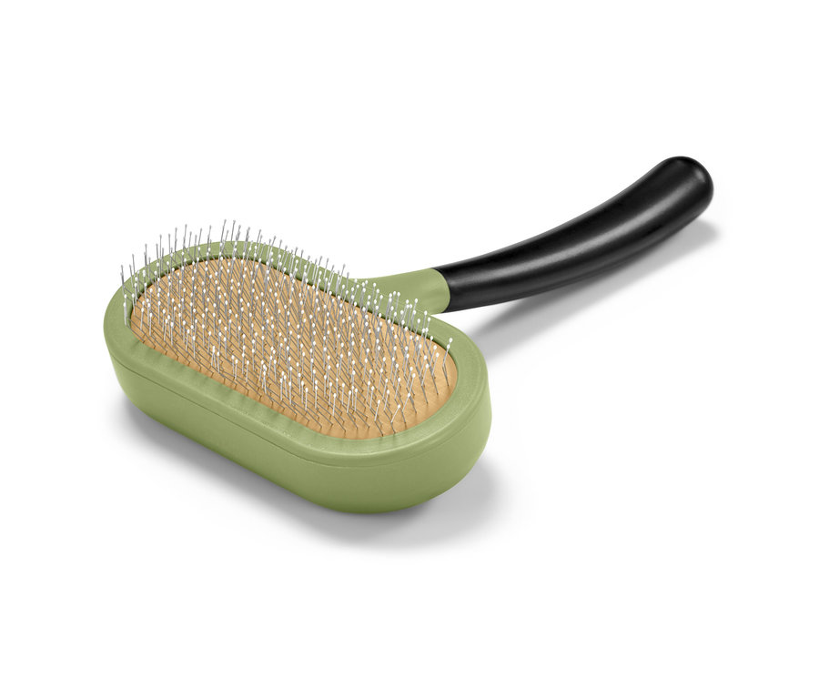 Eine grüne Tier-Fellbürste mit schwarzem Griff.