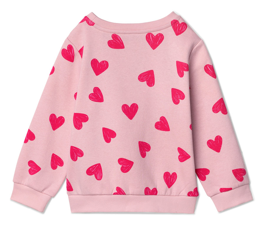Rückansicht eines hellrosa Pullovers mit rotem Herzmuster.