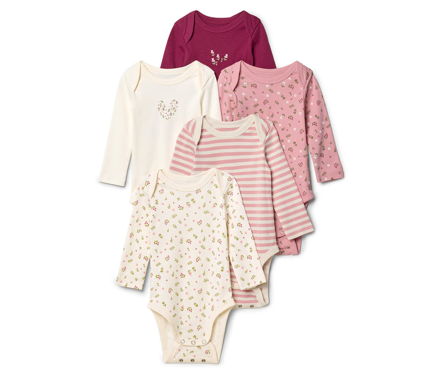 Fünf langärmelige Babybodys liegen übereinander, darunter gestreift, mit Blumenmuster und einfarbig.