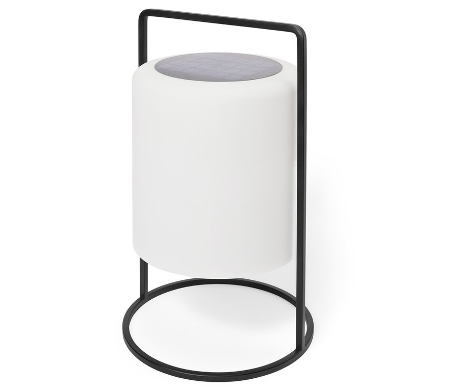 Eine zylindrische, weiße Lampe mit einem grauen, karierten Oberteil steht in einem schwarzen Metallrahmen.