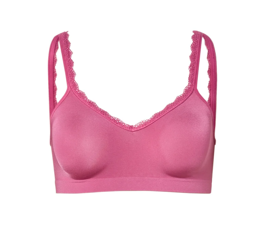 Nahaufnahme eines pinkfarbenen BHs mit Spitze an den Trägern und am Dekolleté.