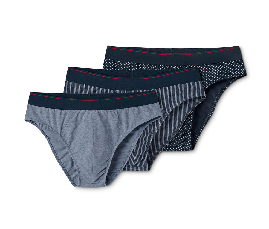 Drei Slips in verschiedenen Designs: grau, gestreift und gepunktet.