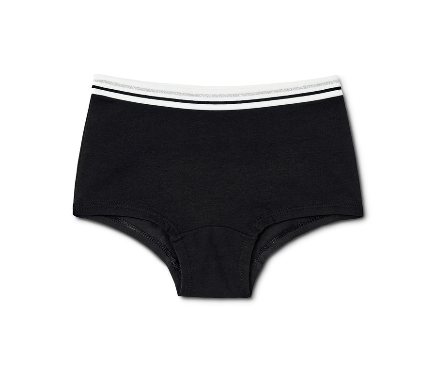 Schwarze Mädchen-Pantys mit weißem Bund. 7 Mädchen-Pantys, schwarz-weiß.