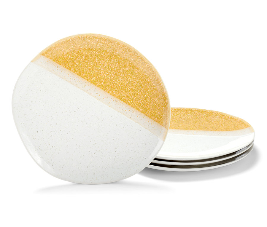 Ein Stapel aus 4 Tellern in Weiß und Gold.