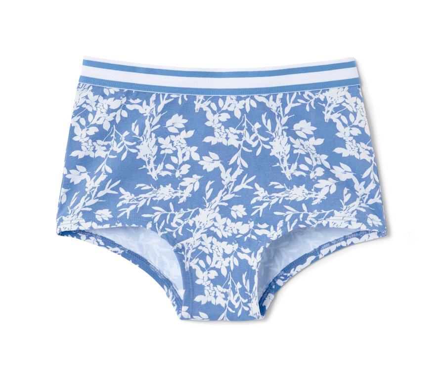 Ein blauer Mädchen-Panty mit einem weißen Blumenmuster. 7 Mädchen-Pantys.