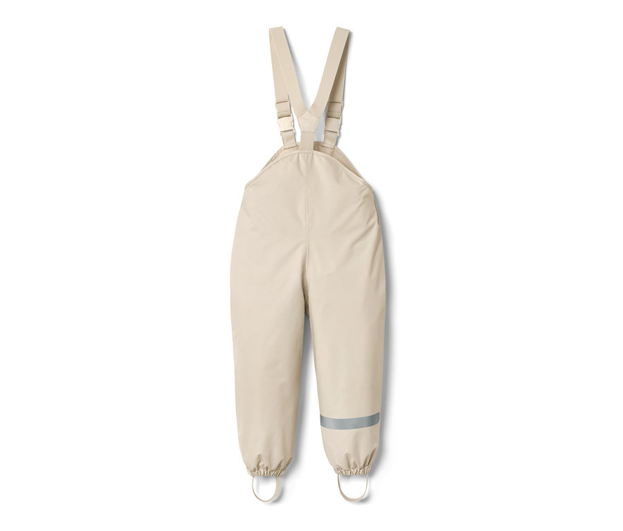 Sandfarbene Kleinkinder-Regenhose mit Latz und Reflektorstreifen am Hosenbein.