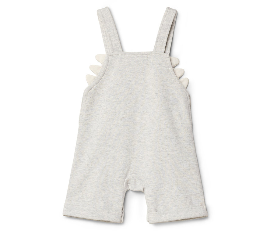 Ein grauer Baby-Strampler mit weißen Dinosaurierzacken am Ärmel.