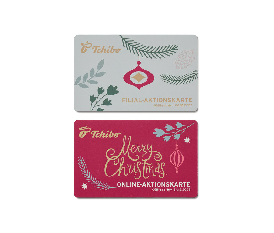 Zwei Tchibo-Karten mit Weihnachtsmotiven.