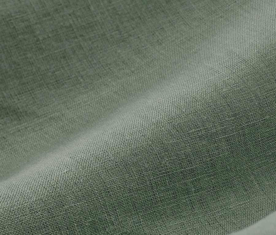 Nahaufnahme von grüner Leinen-Bettwäsche in Normalgröße und Übergröße.