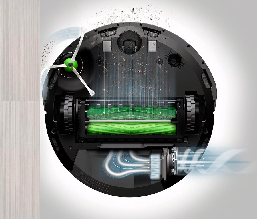 Detailansicht der Unterseite des schwarzen iRobot Roomba i1 Saugroboters, wobei Bürsten und Mechanismen sichtbar sind.