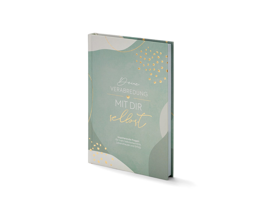 Das Buch »Deine Verabredung mit dir selbst« liegt auf einer weißen Oberfläche.