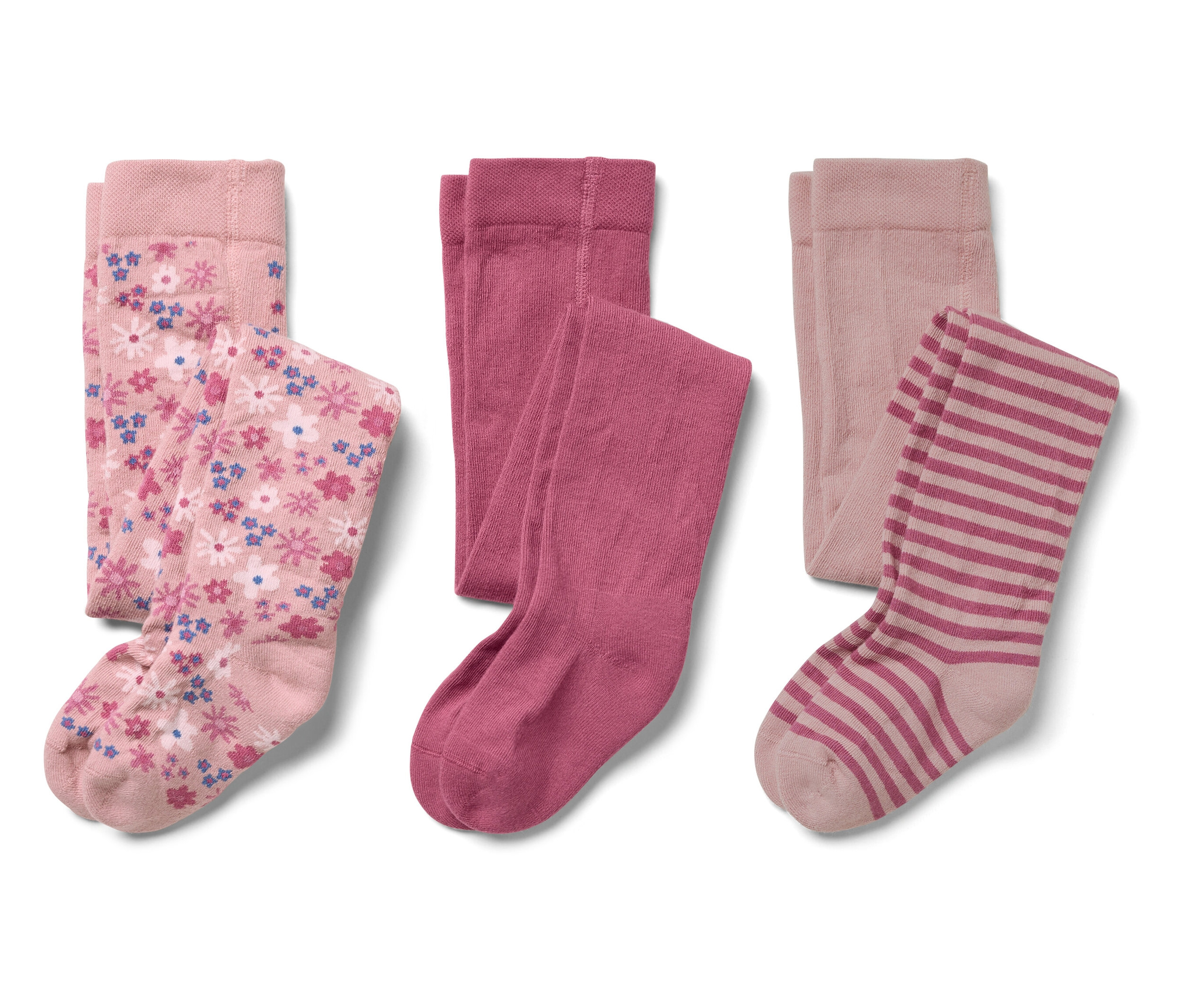 Drei Paar Kinderstrumpfhosen: rosa mit Blumenmuster, einfarbig rosa und gestreift rosa.