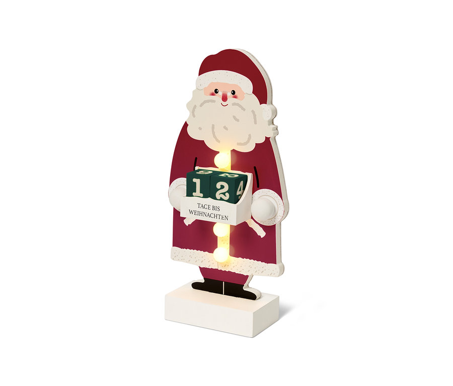 Eine hölzerne Weihnachtsmann-Figur mit Adventskalender.