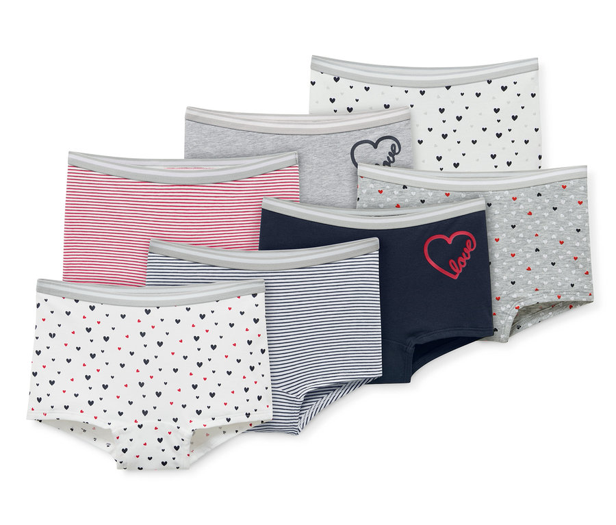 Sieben Mädchen-Pantys in verschiedenen Farben und Mustern.