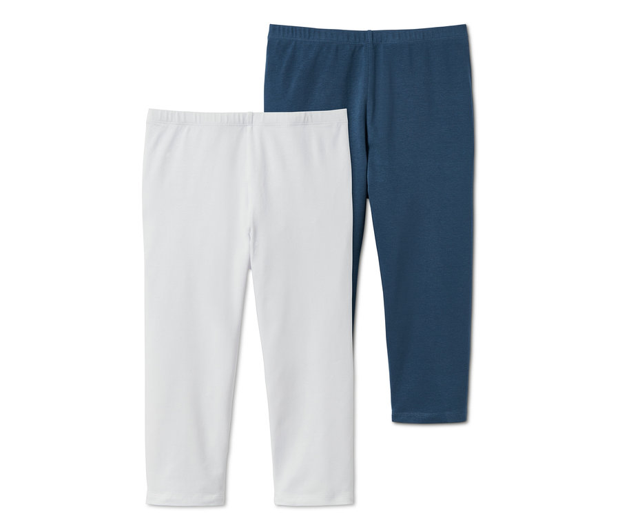 Zwei 3/4-Leggings aus Bio-Baumwolle: eine weiße und eine dunkelblaue.