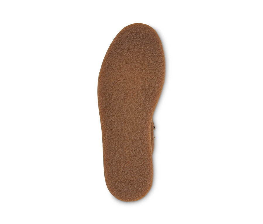 Braune Sohle eines Veloursleder-Boots.