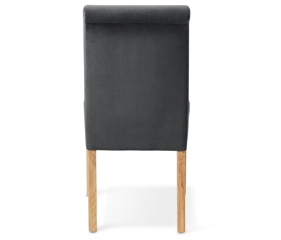 Rückansicht eines gepolsterten Esszimmer-Stuhls mit Stoffbezug.