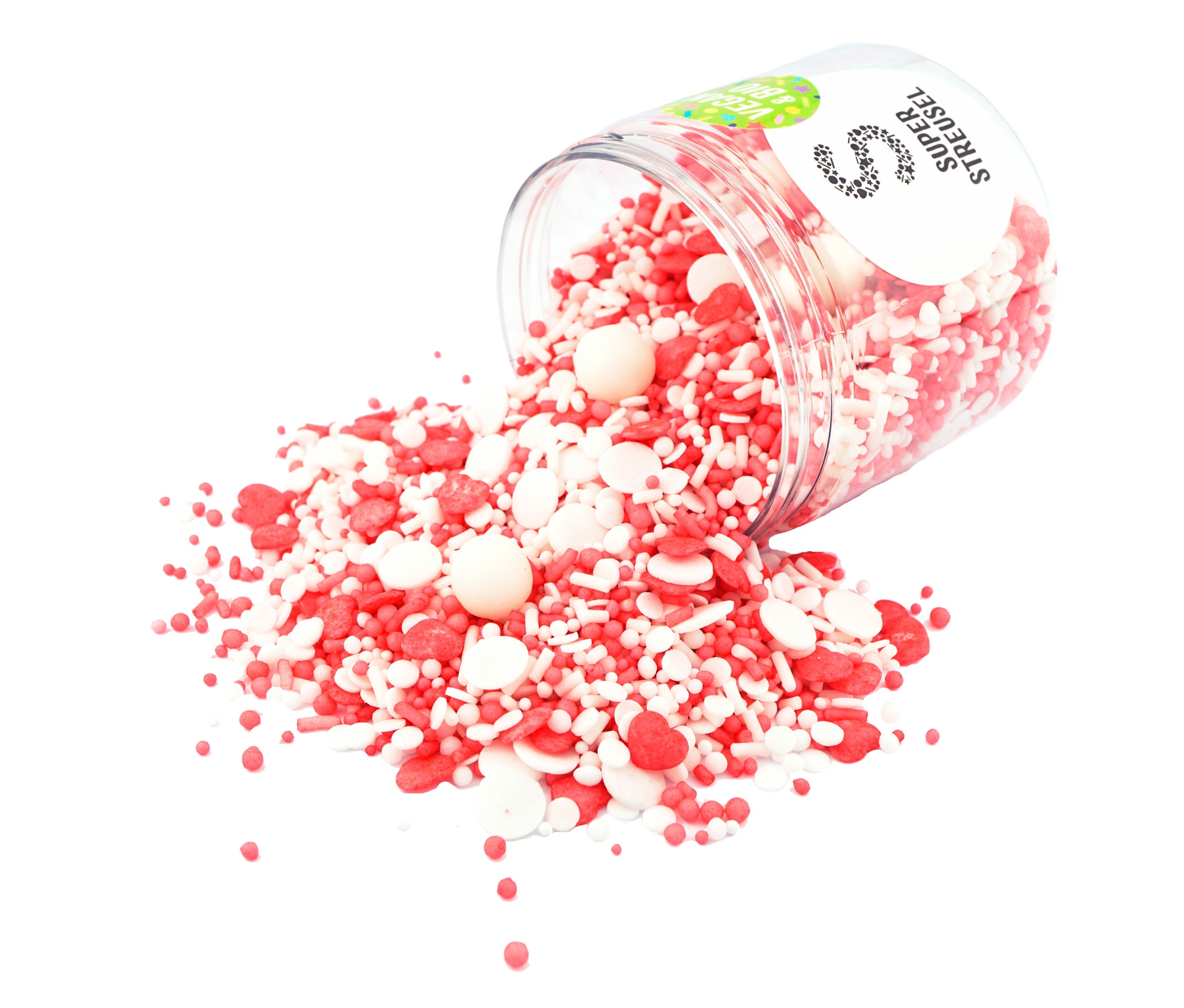 Eine geöffnete, durchsichtige Dose schüttet Super Streusel »EinUndAlles« - Zuckerstreuselmix aus, der rote und weiße Streusel in verschiedenen Formen enthält.