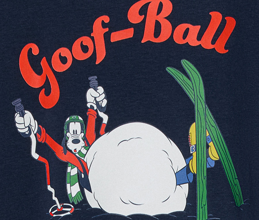 Cartoonfigur Goofy mit Skiausrüstung in verschneiter Szene mit dem Schriftzug "Goof-Ball".