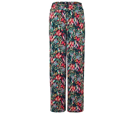 Eine lange Hose mit einem bunten Blattmuster auf dunklem Grund.
