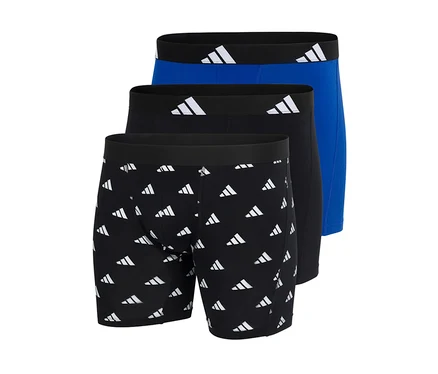 Drei adidas Active Flex Cotton Slipboxer: einer schwarz mit weißem Logo-Muster, einer einfarbig schwarz und einer einfarbig blau. Alle haben schwarze Bundbänder mit weißen adidas Logos.