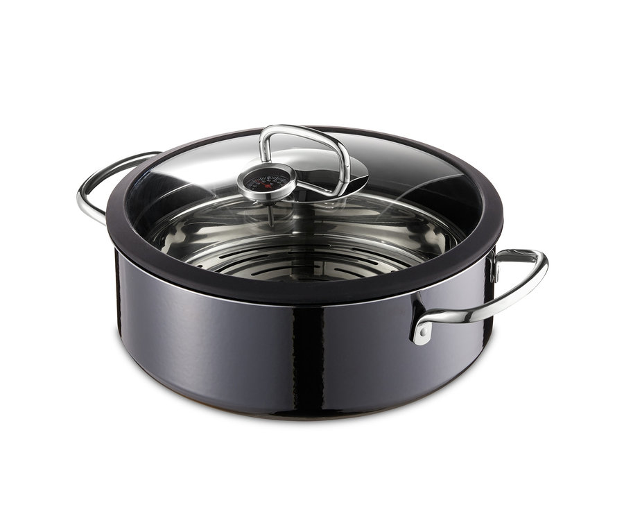 Ein schwarzer, runder Silit-Dampfgarer Ecompact Professional mit transparentem Deckel.