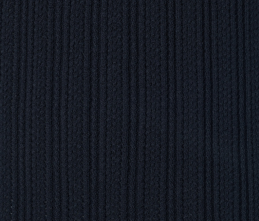 Detailaufnahme eines Stricktops mit Ajourmuster.