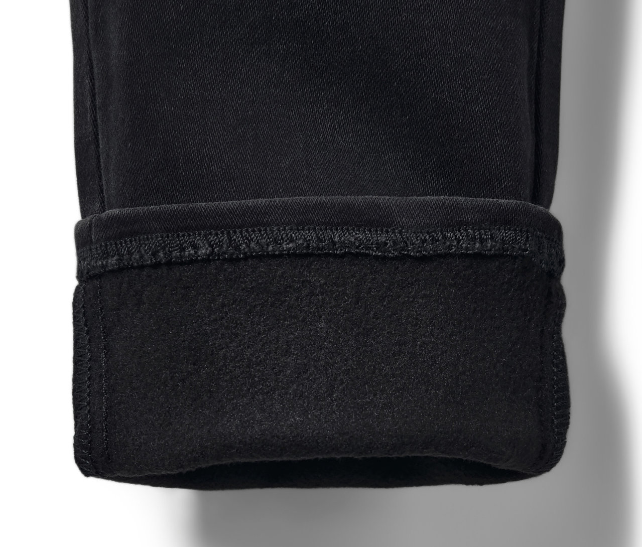Detailaufnahme von Kinder-Treggings – Fit »Jule« in Schwarz mit umgeschlagenem Saum.