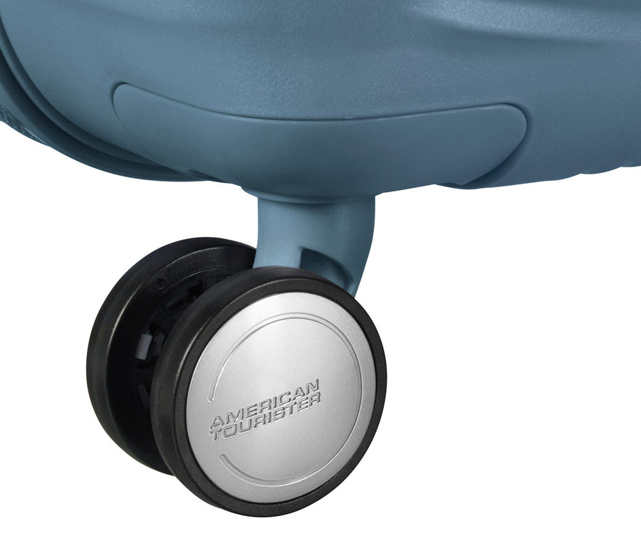 Detailaufnahme eines stone blue American Tourister Hartschalen-Koffers »Soundbox« Spinner.