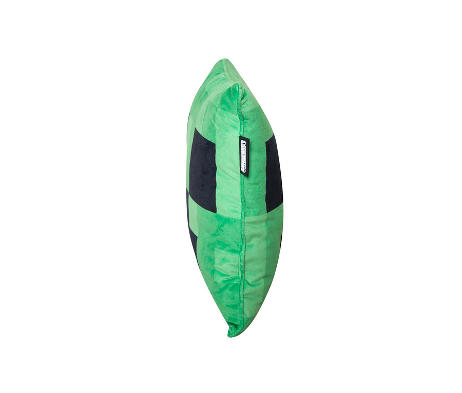 Ein grünes MINECRAFT Dekokissen, Creeper, mit schwarzen Quadraten.