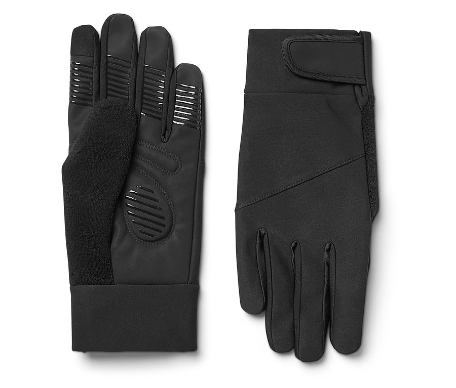Zwei schwarze Handschuhe liegen nebeneinander. Einer liegt mit dem Handrücken nach oben und der andere mit der Handfläche nach oben.