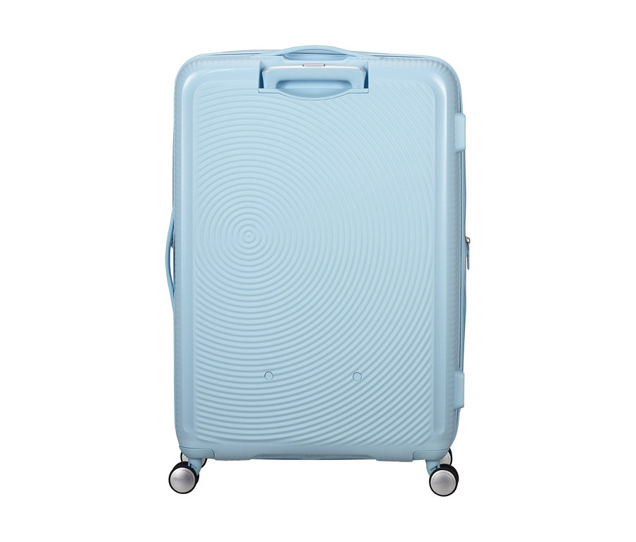 Großer American Tourister Soundbox Spinner Hartschalenkoffer in Pastellblau mit konzentrischem Kreismuster, Griff und vier Rollen.