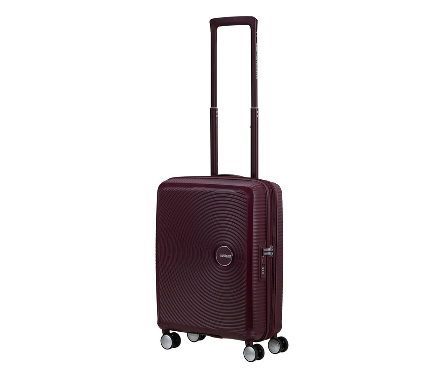 Kleiner American Tourister Hartschalen-Koffer Soundbox Spinner in Wildkirsche mit ausziehbarem Griff und Rollen.