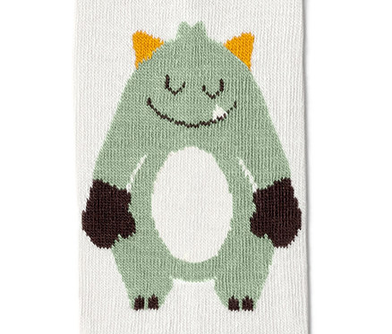 Detailansicht einer grünen Strumpfhose mit Monster-Motiv.