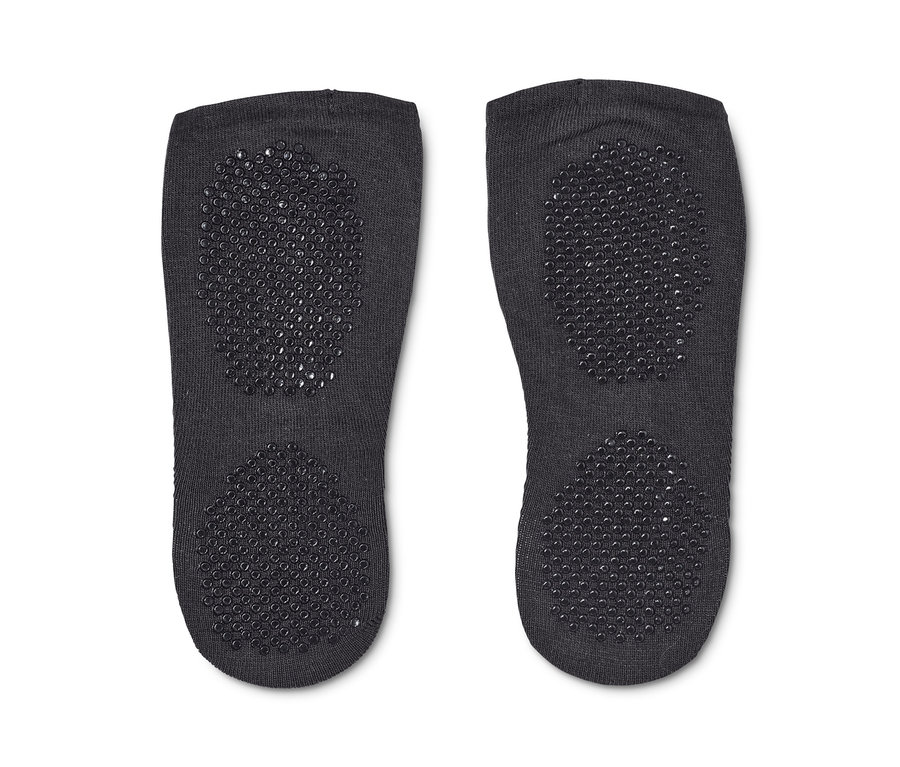 Zwei graue Paar Yogafüßlinge mit rutschfester Sohle.