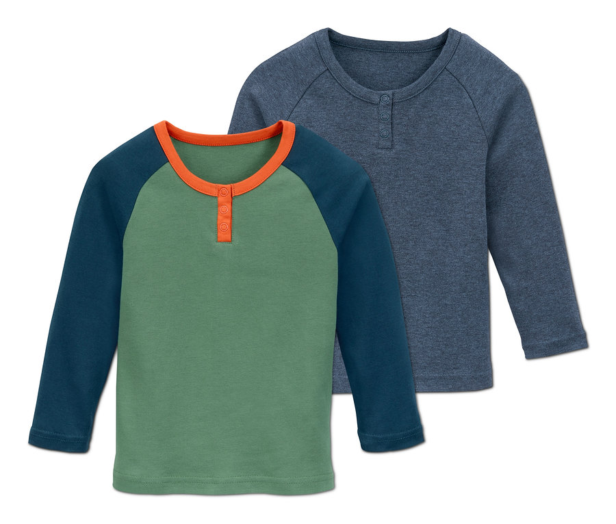 Zwei Interlock-Langarmshirts liegen übereinander.