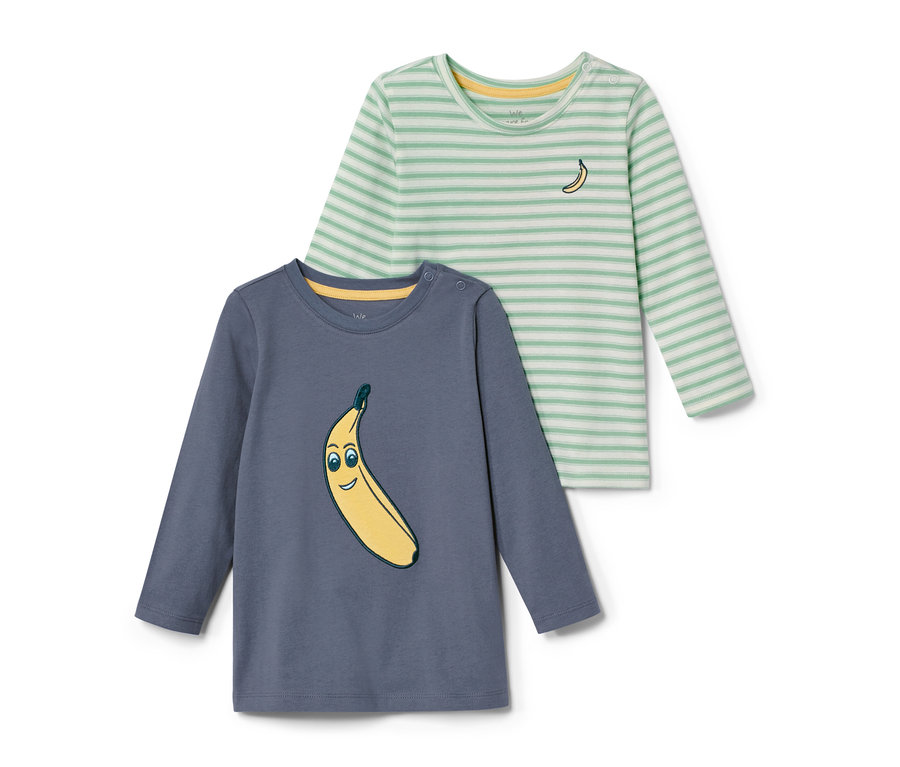 Zwei Kleinkinder-Shirts, eines blau mit Banane, das andere gestreift mit gelbem Rand und kleiner Banane.