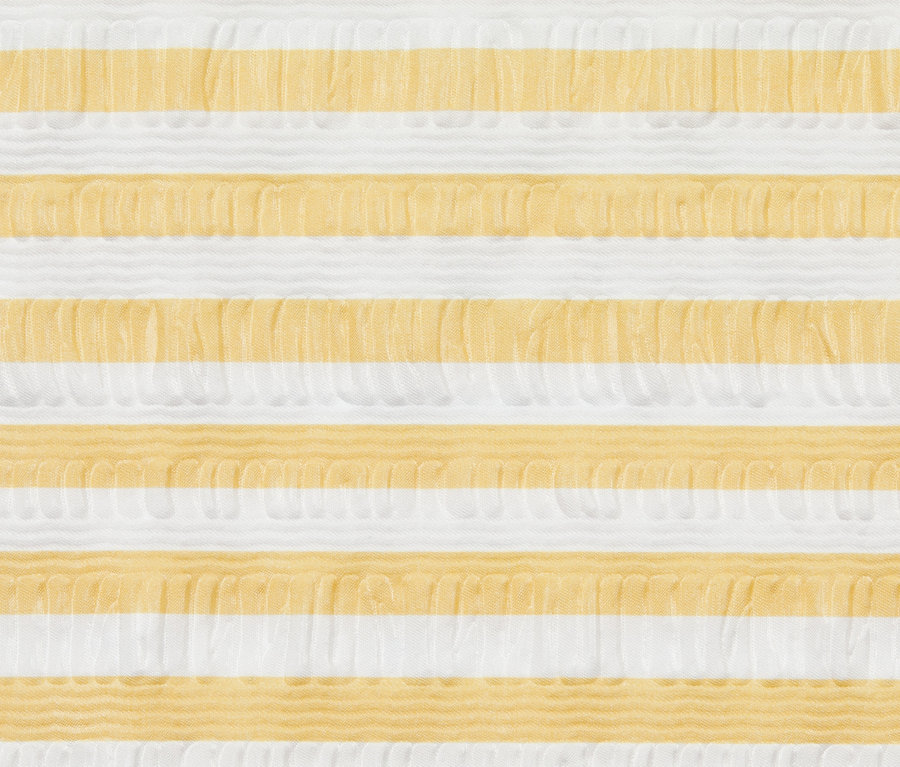 Nahaufnahme von Seersucker-Bettwäsche mit gelben und weißen Streifen.
