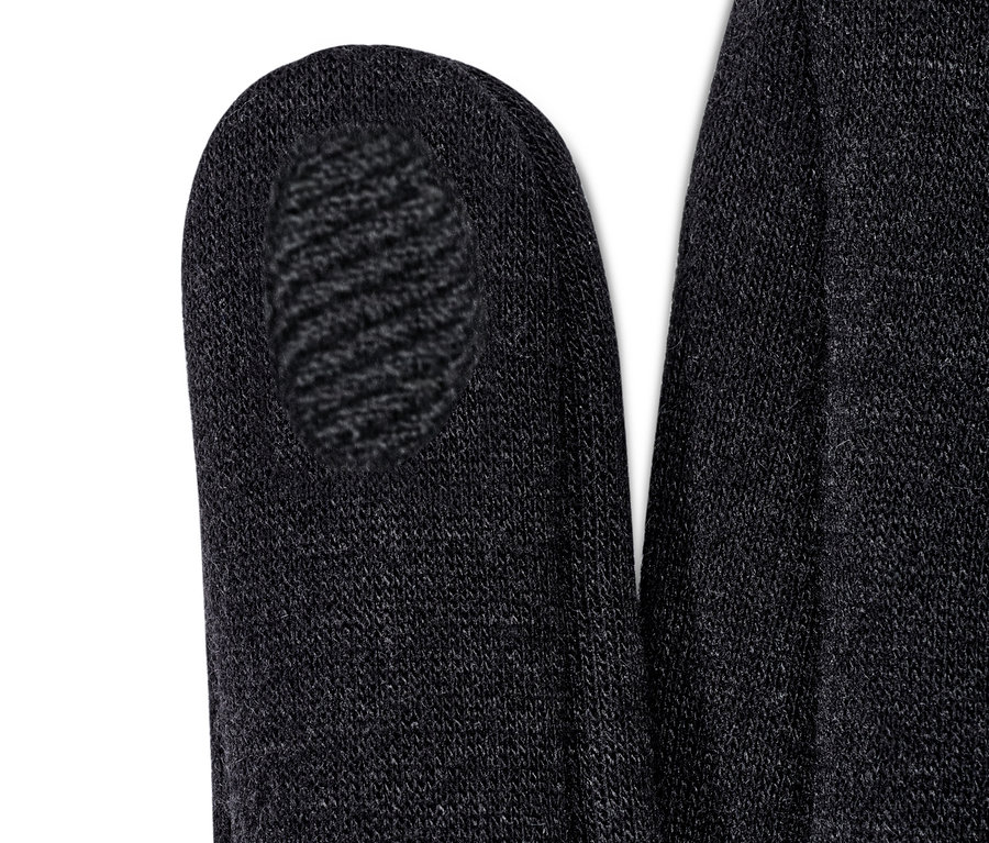 Detailaufnahme von schwarzen Sweathandschuhen.