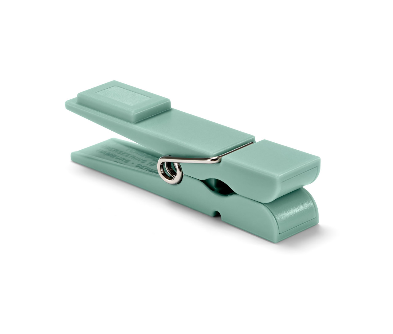 Nahaufnahme eines einzelnen, hellgrünen Kühlschrankmagneten.