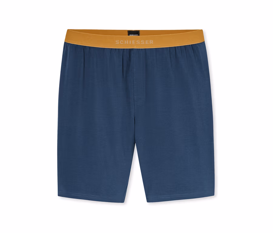 Blaue Shorts mit einem braunen Gummibund, auf dem „SCHIESSER“ in weißen Buchstaben steht.